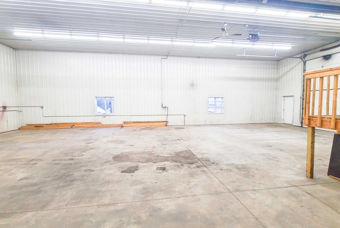 Small commercial space for rent that is used for contractor workshop or storage.