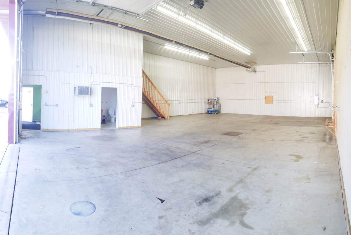 Warehouse with concrete floors and a floor drain.