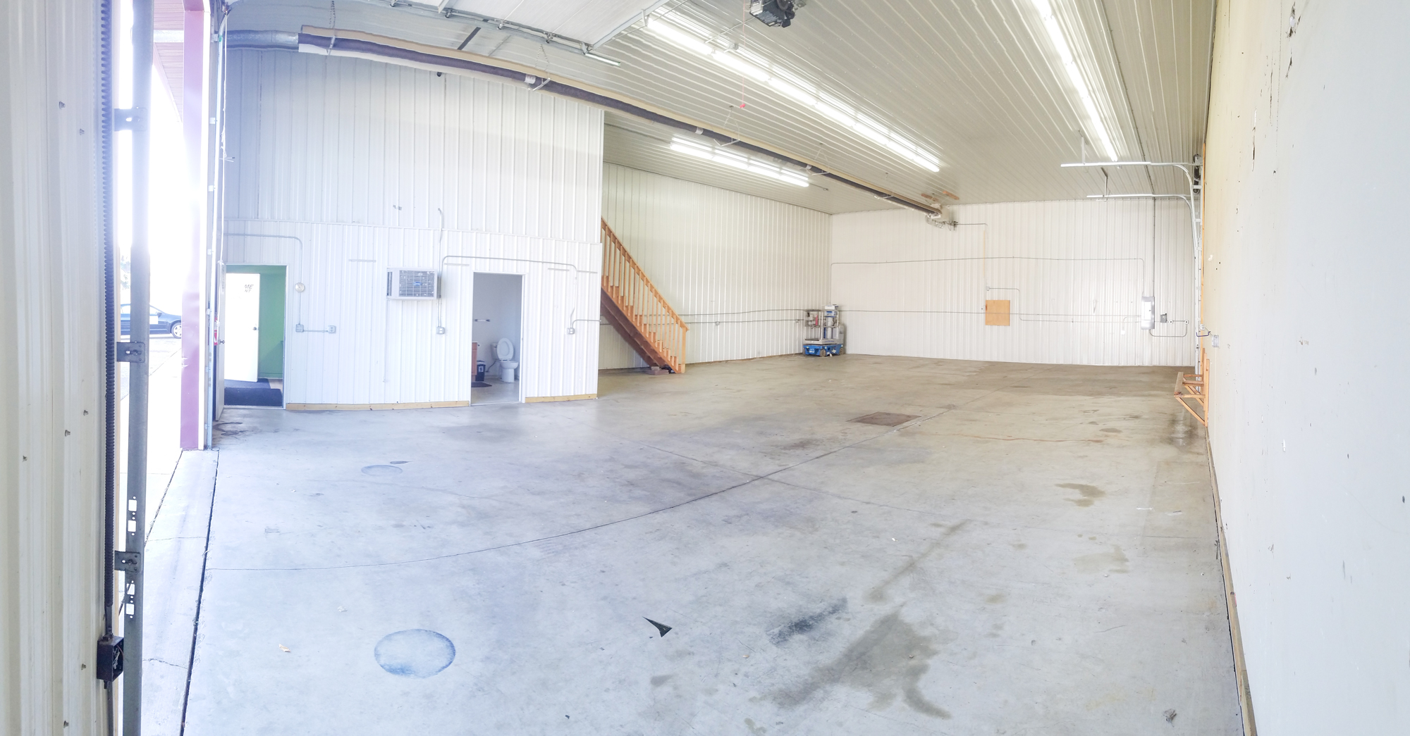 Warehouse with concrete floors and a floor drain.