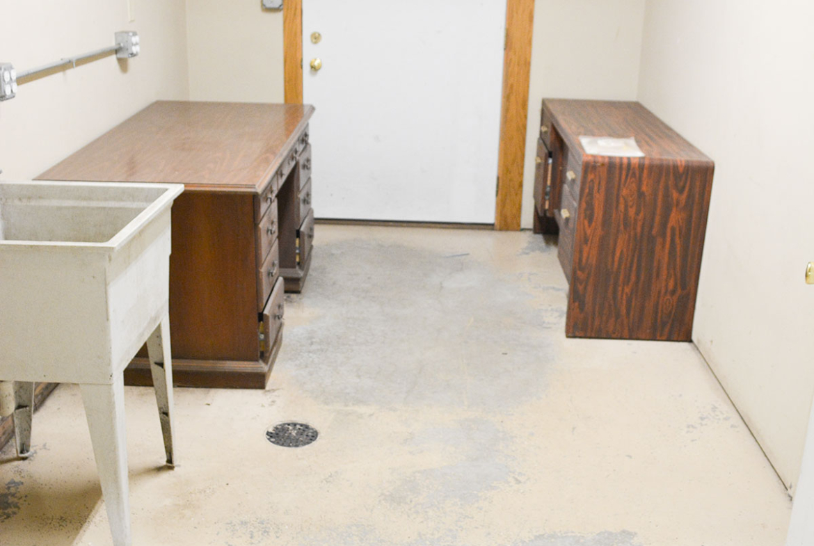 Back office and clean up room with laundry sink.