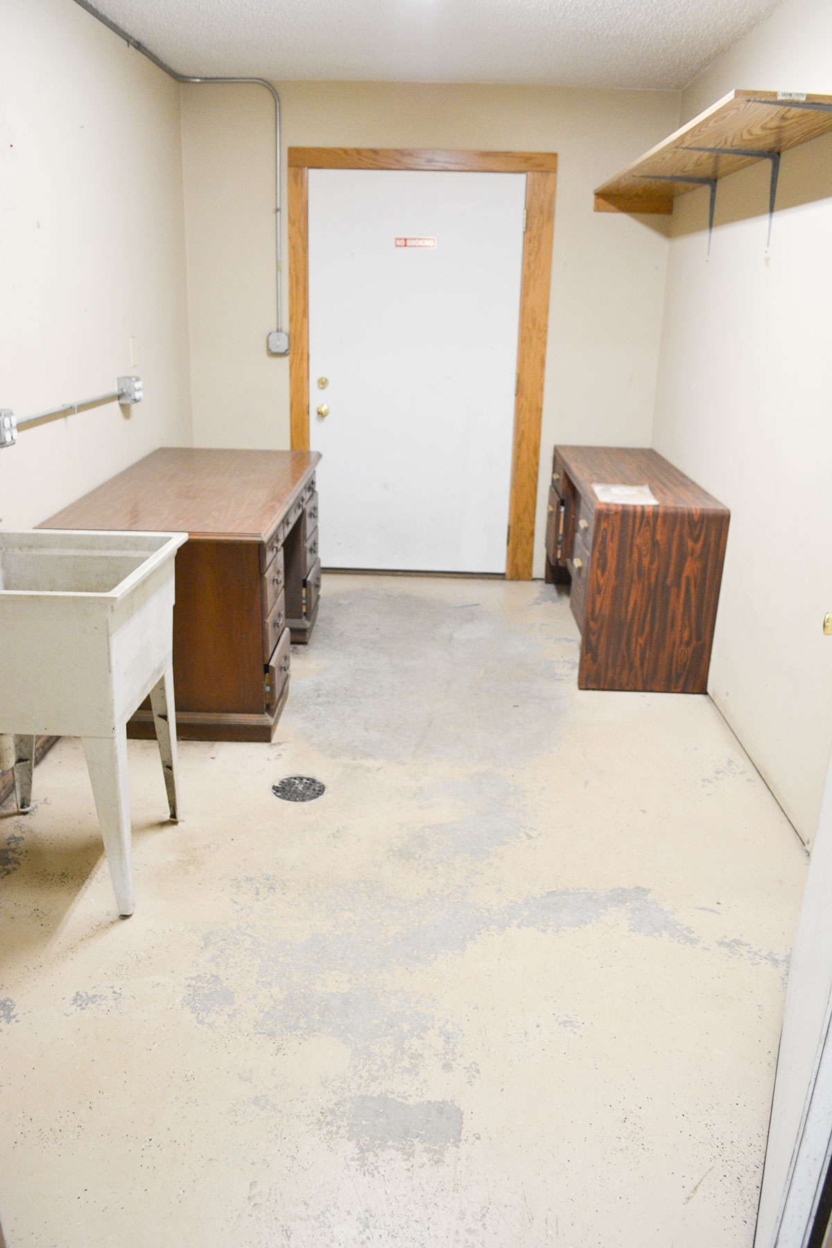 Back office and clean up room with laundry sink.