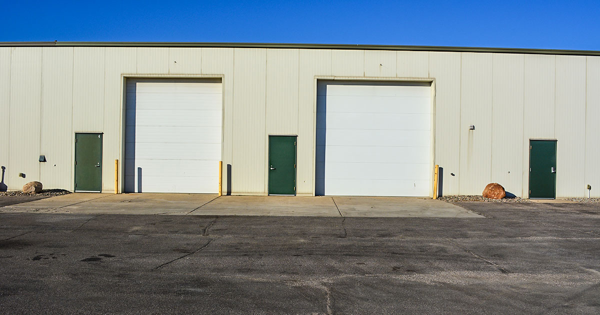 2 garage doors and 2 steel entry doors on this flex space for rent.